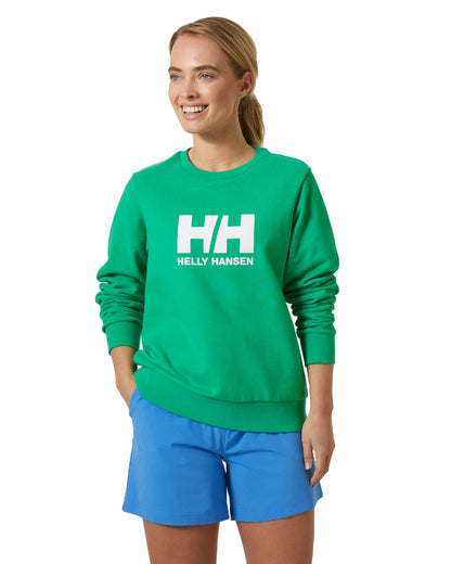Bright Green coloured Helly Hansen Womens Logo Crew Sheatshirt 2.0 on a white background 