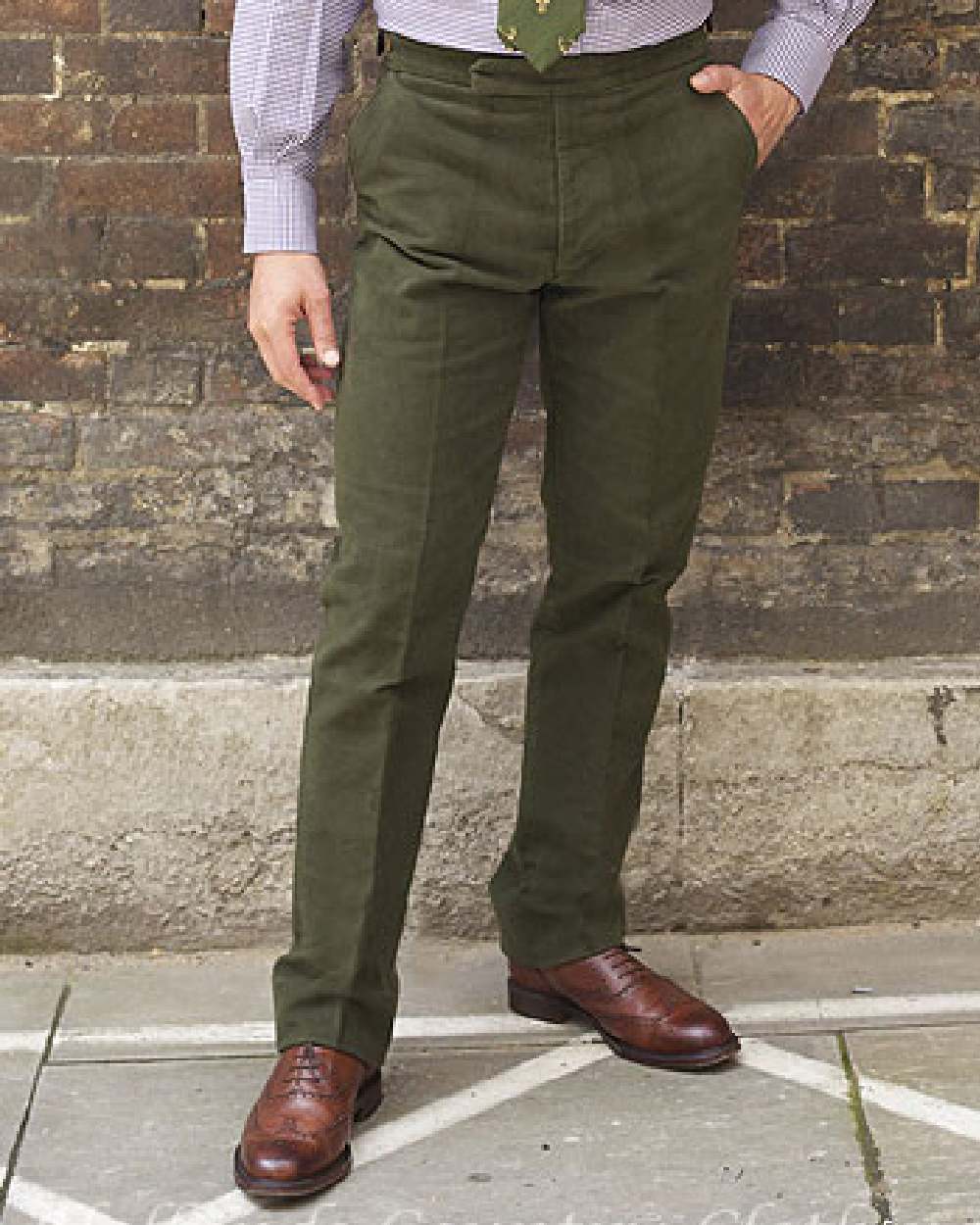 Olive coloured Bronte Moleskin Trousers on rock background 