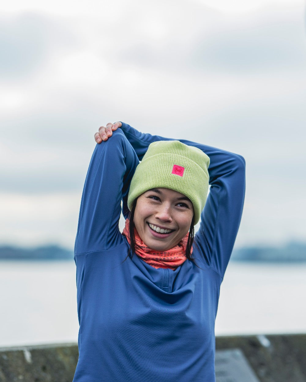 Sheen Yellow Coloured Buff CrossKnit Beanie on blurry background 