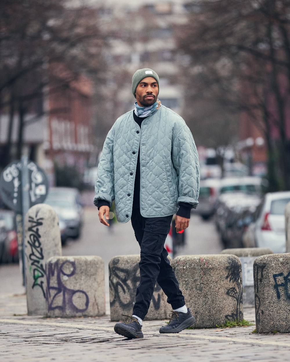 Silversage Coloured Buff Drisk Knitted Beanie on street background 