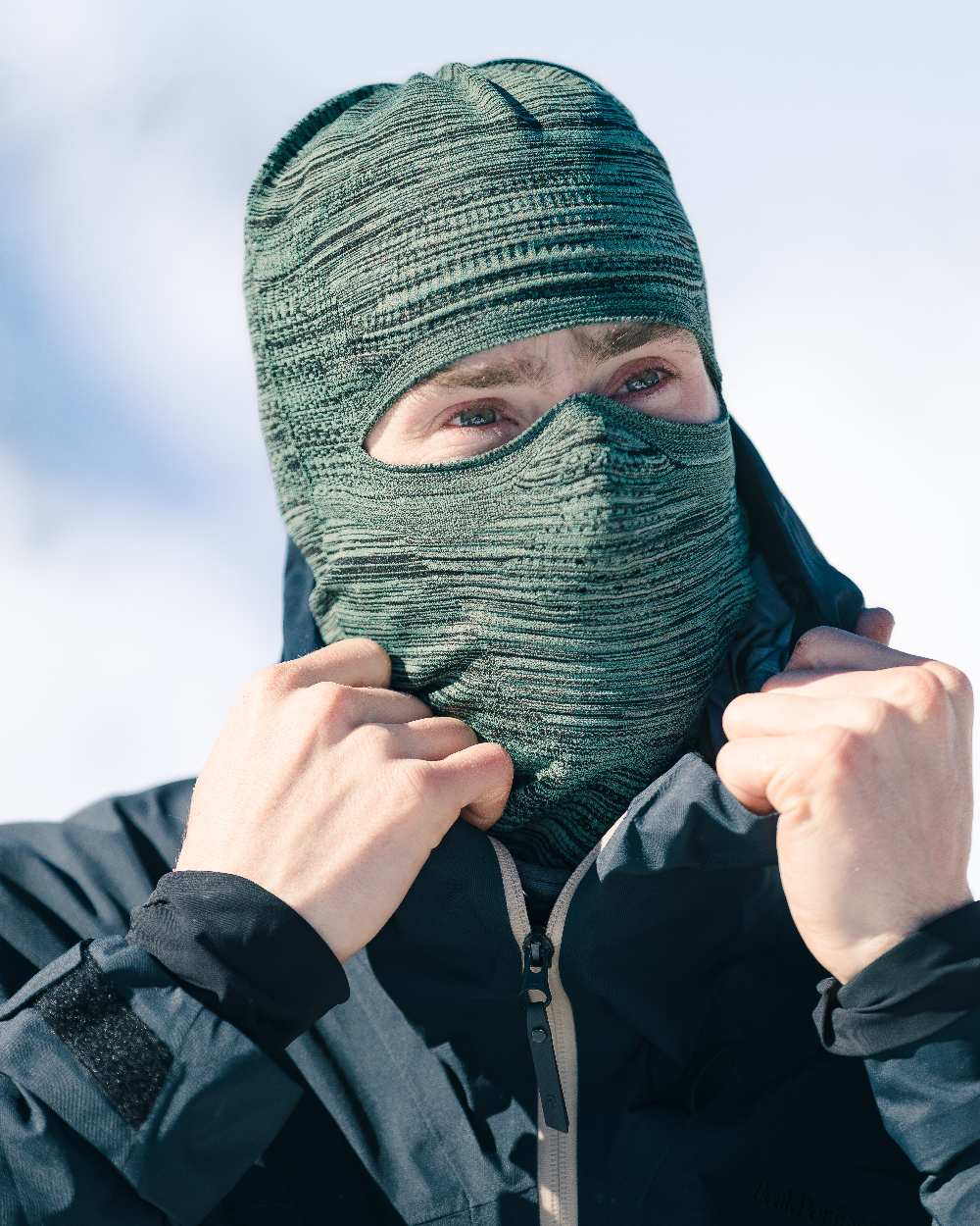 Jade Coloured Buff Dryflx Pro Solid Balaclava on blurry background 