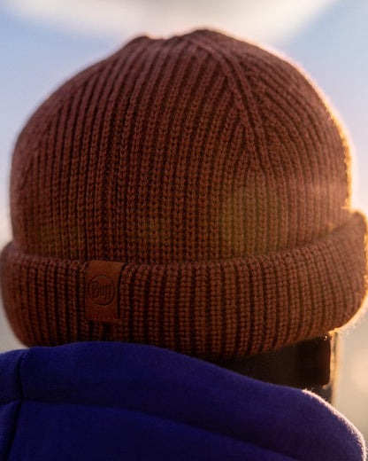 Cinnamon Coloured Buff Knitted Ervin Beanie on sky background 