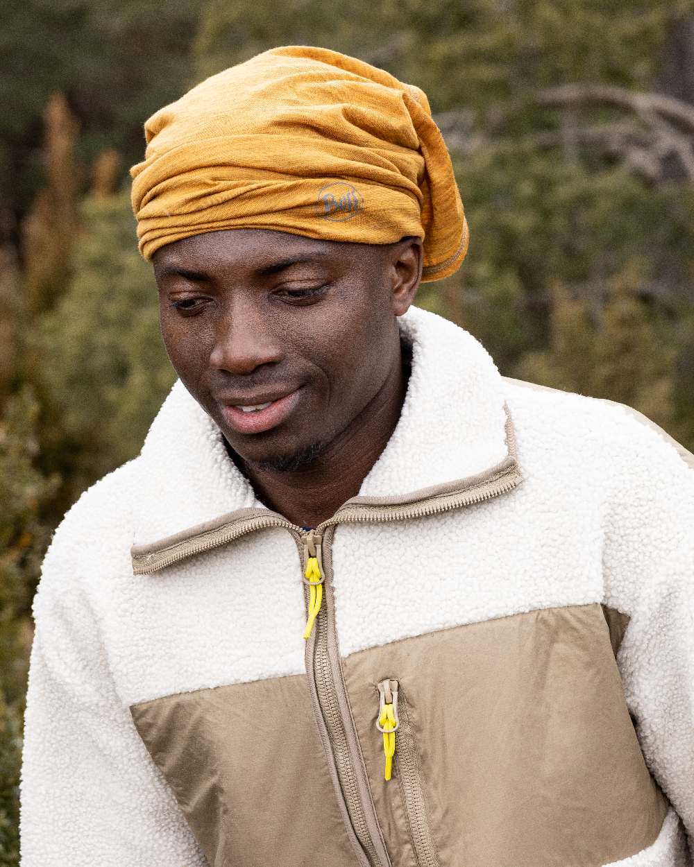 Mustard Coloured Buff Merino Lightweight Neck Warmer on outdoor background 