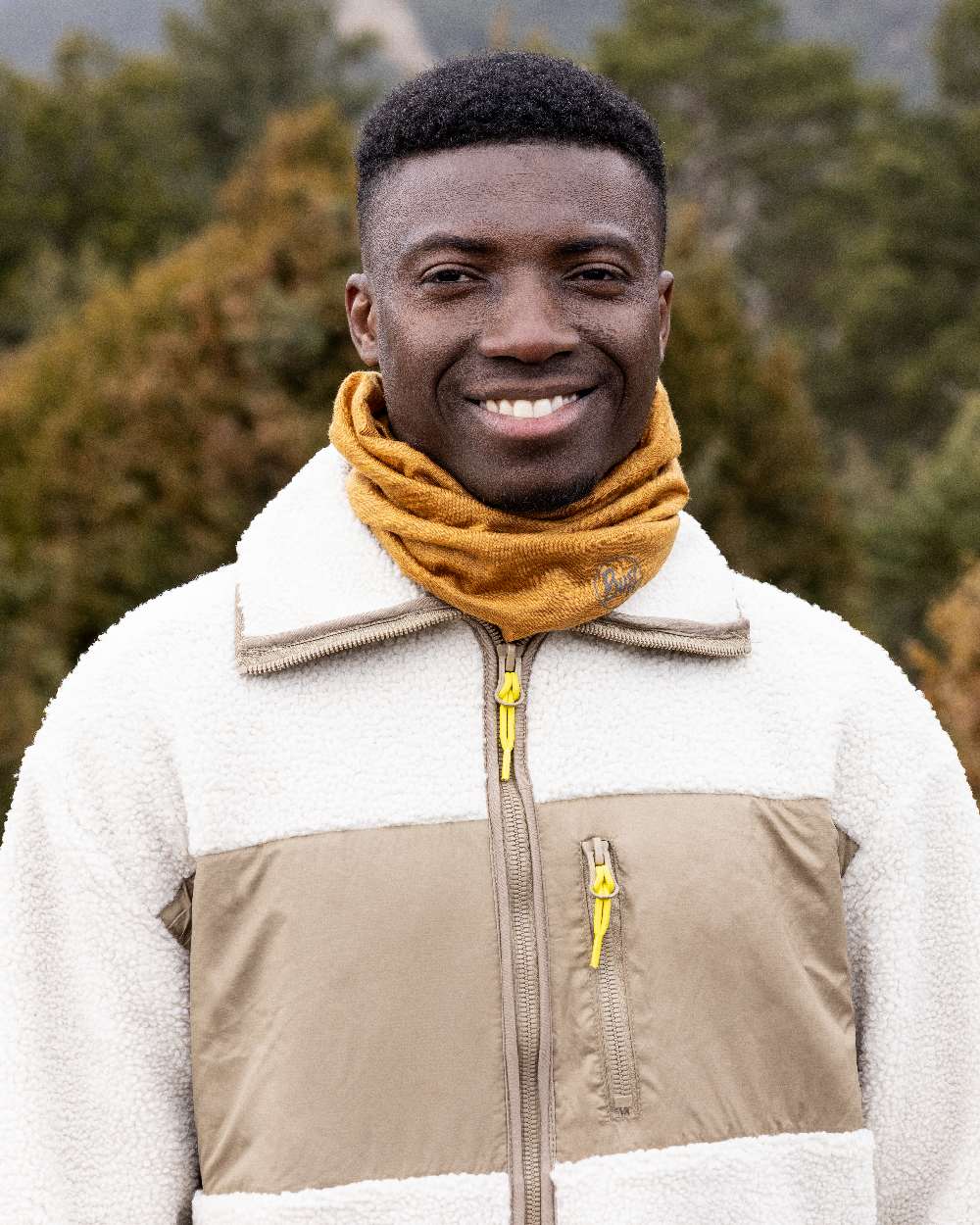 Mustard Coloured Buff Merino Lightweight Neck Warmer on outdoor background 