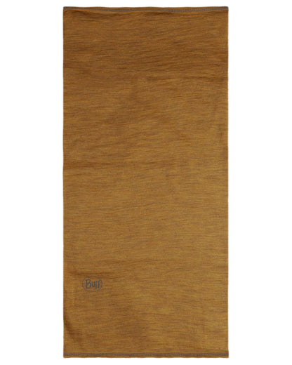 Mustard Coloured Buff Merino Lightweight Neck Warmer on outdoor background 