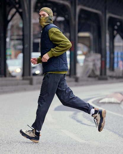 Khaki Coloured Buff Nilan Knitted Balaclava on blurry background 