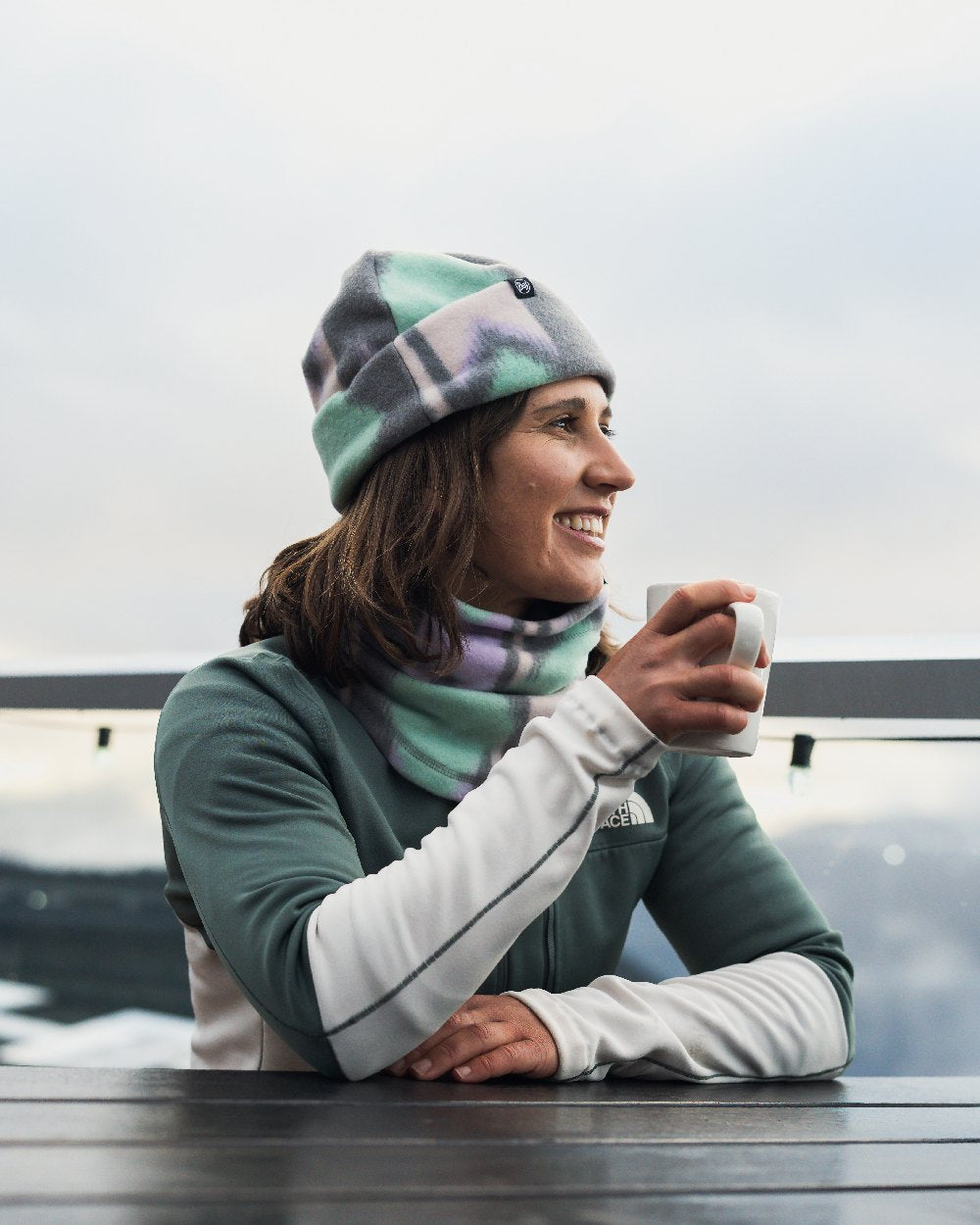 Cusha Multi Coloured Buff Polar Prints Beanie on terrace background 