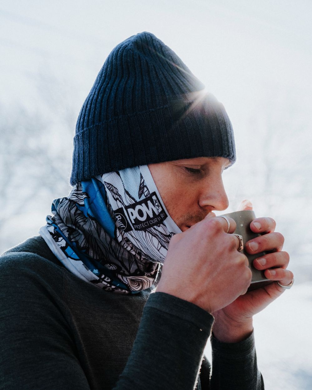 Midnight Coloured Buff Rutger Knitted Beanie on sky background 