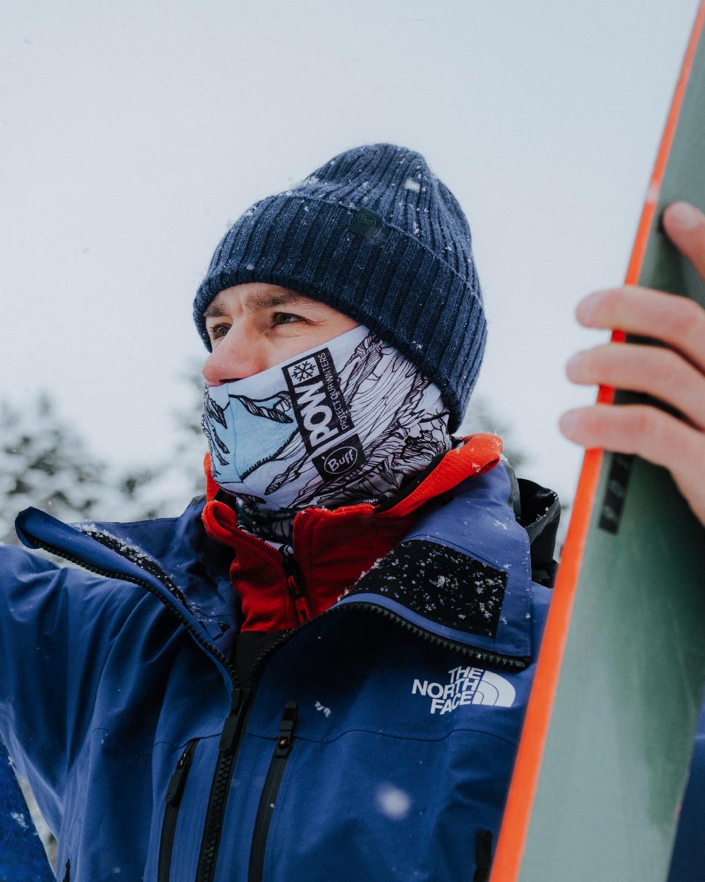 Midnight Coloured Buff Rutger Knitted Beanie on snow background 