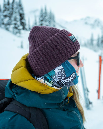 Purple Coloured Buff Rutger Pow Shadow Knitted Beanie on snow background 