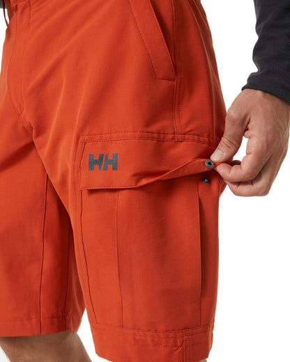 Canyon coloured Helly Hansen mens quick dry cargo shorts on white background 