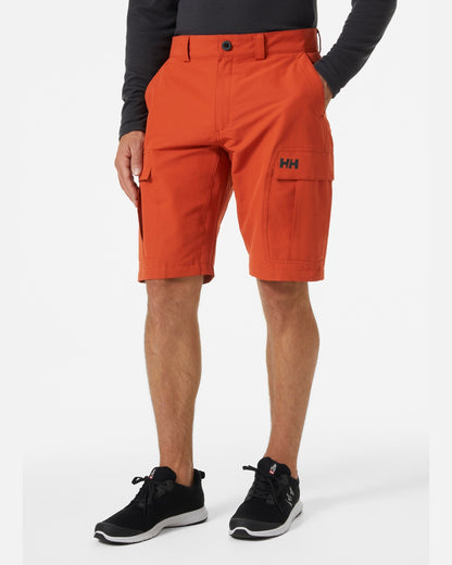 Canyon coloured Helly Hansen mens quick dry cargo shorts on grey background 