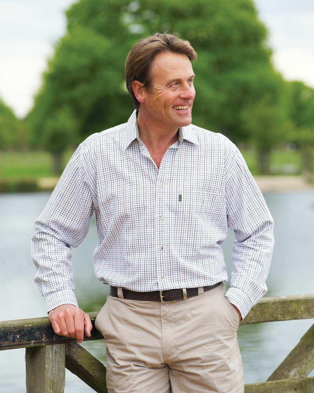 Blue coloured Champion Ayr Heavyweight All Cotton Tattersall Shirt on river background 