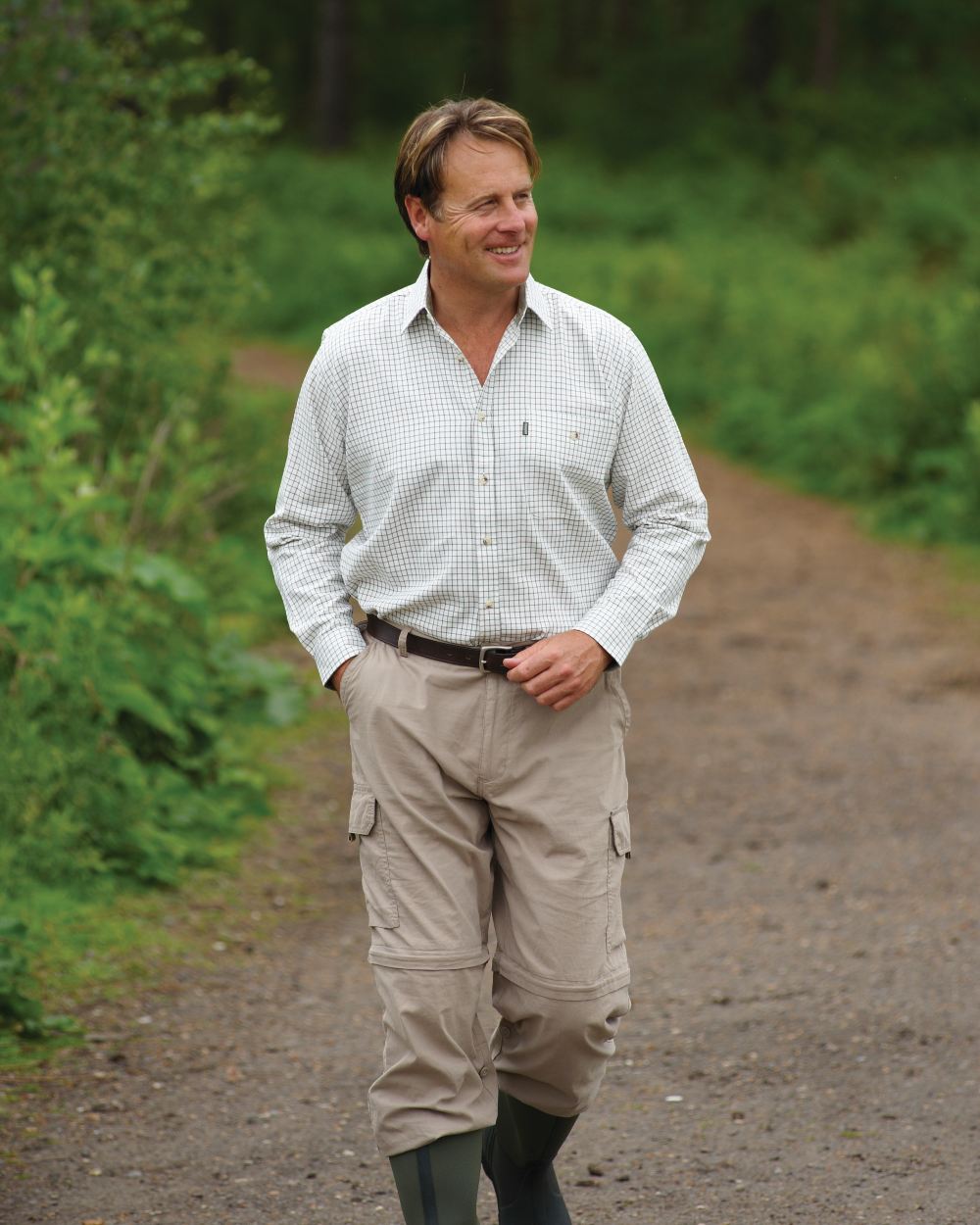 Green coloured Champion Ayr Heavyweight All Cotton Tattersall Shirt on forest background 