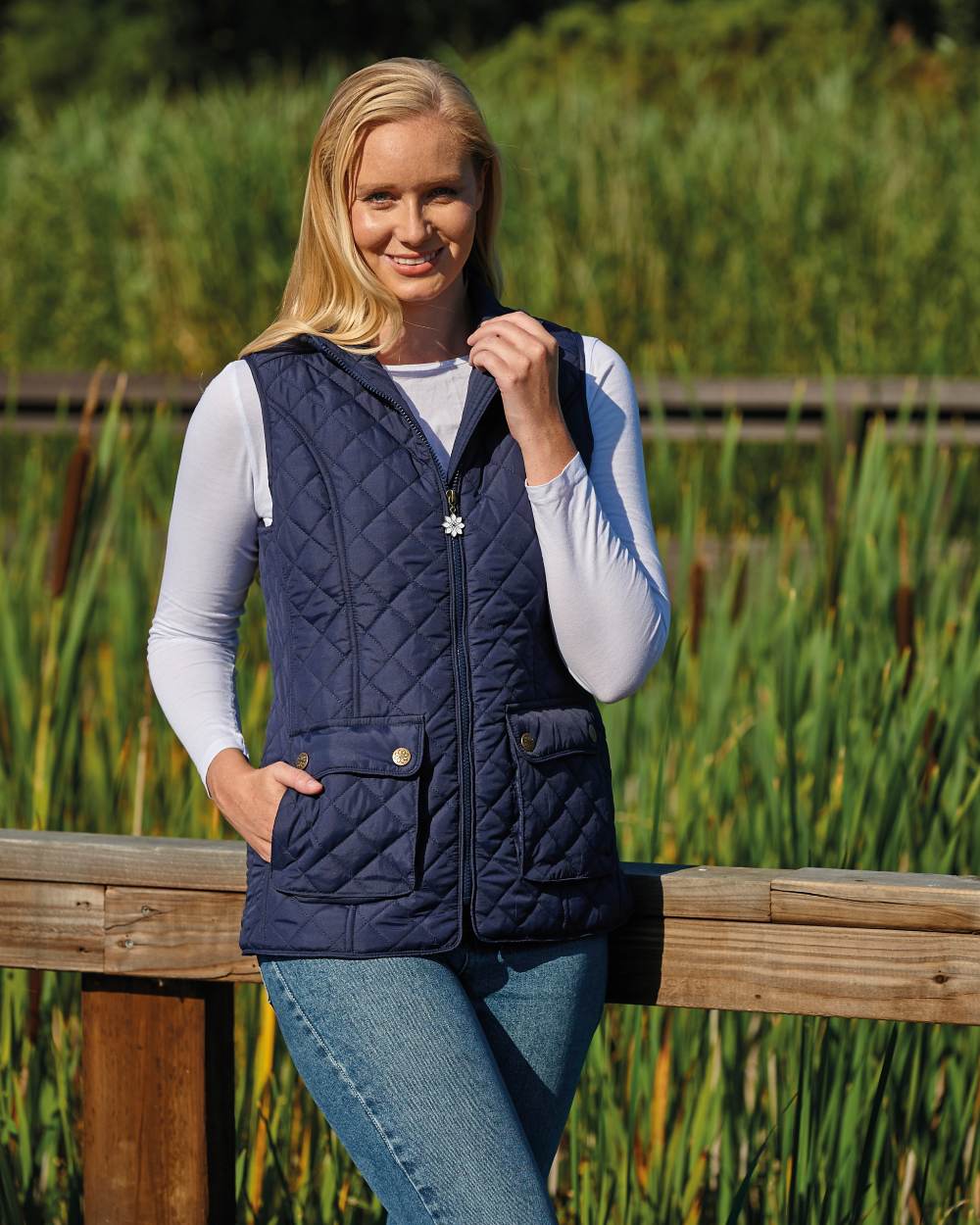 Navy coloured Champion Banbury Ladies Gilet on farm background 