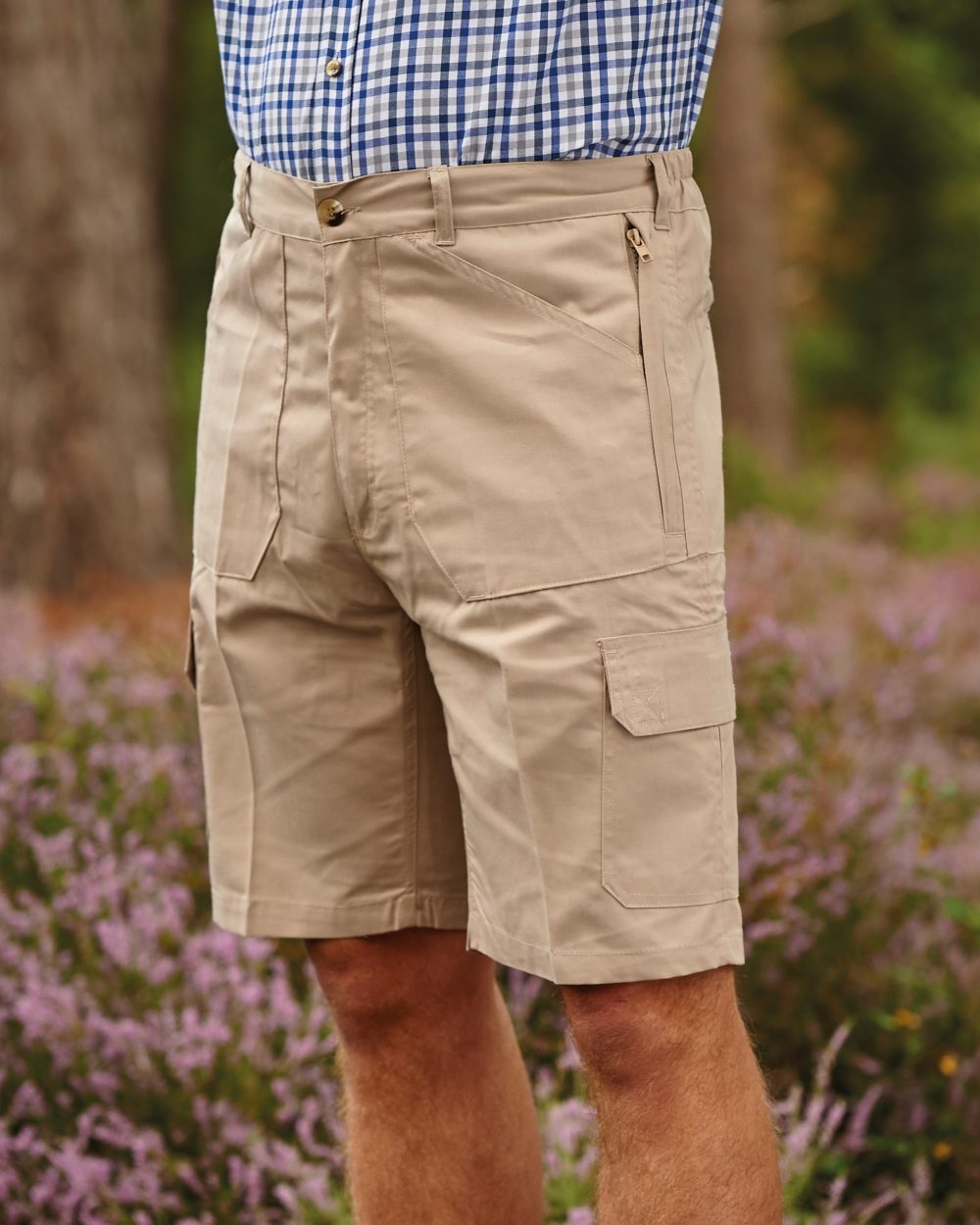 Stone coloured Champion Bretton Multi-Pocket Activity Shorts on backyard background 