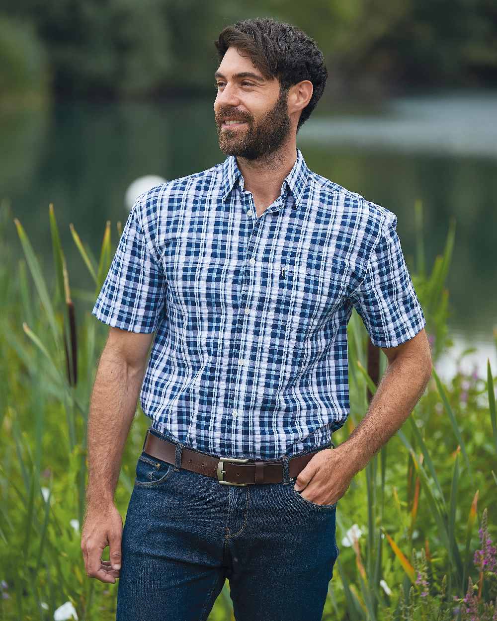 Blue coloured Champion Croyde Cotton Short Sleeved Shirt on river background 
