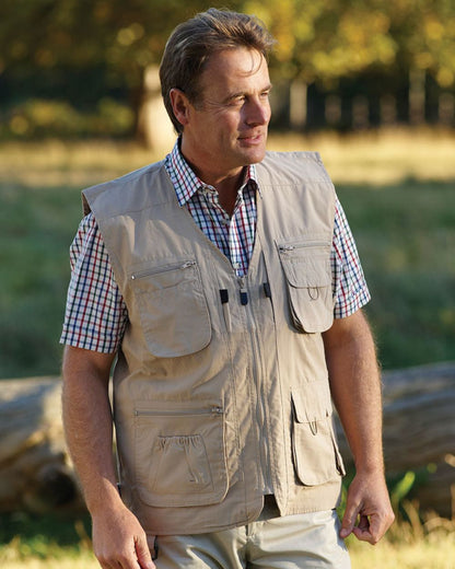 Stone coloured Champion Dale Gilet on a blurry park background 