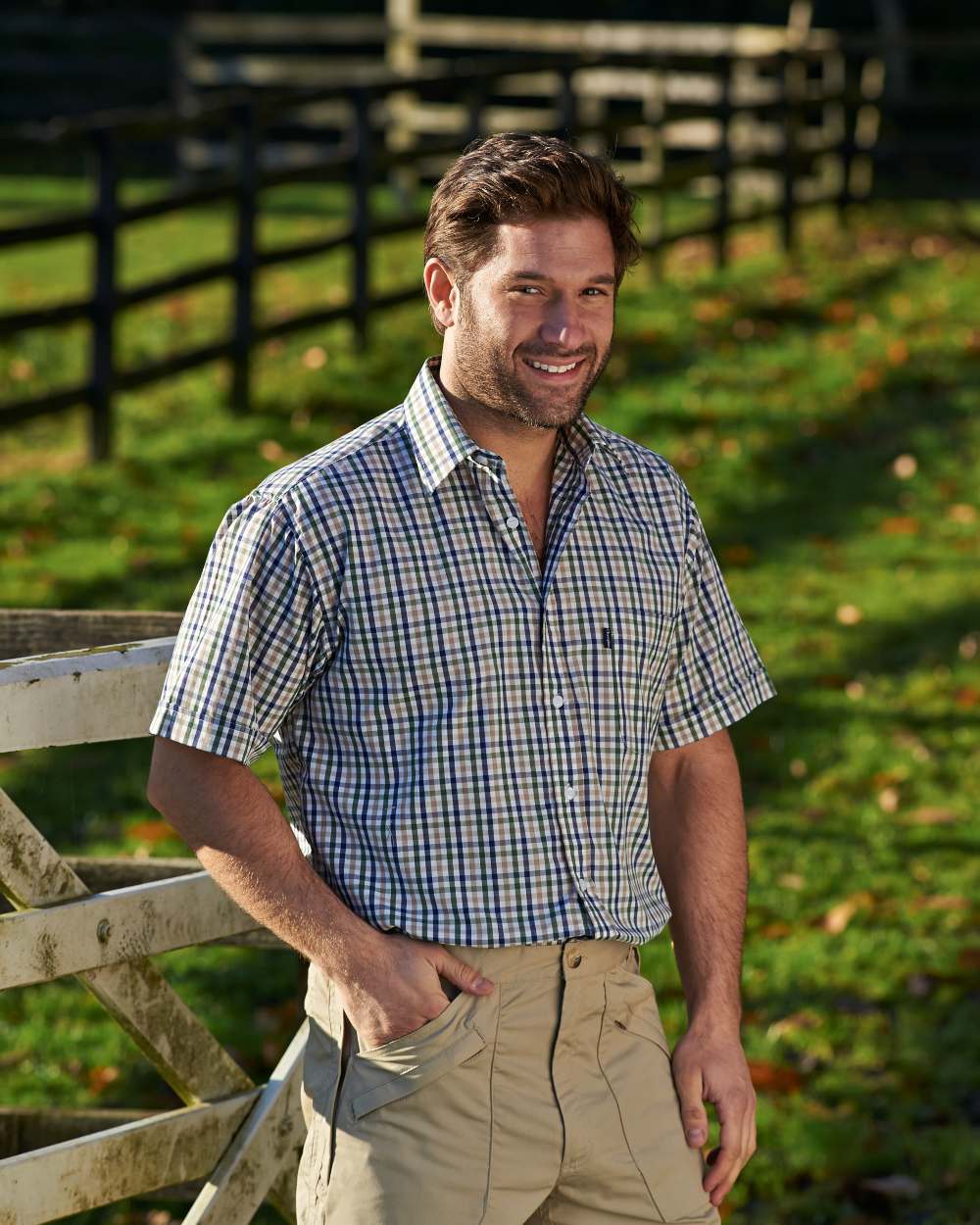 Green Blue coloured Champion Doncaster Short Sleeved Shirt on backyard background 