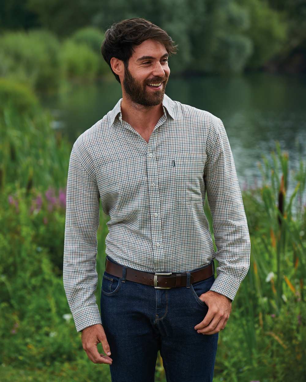 Green coloured Champion Epsom Long Sleeve Shirt on pond background 