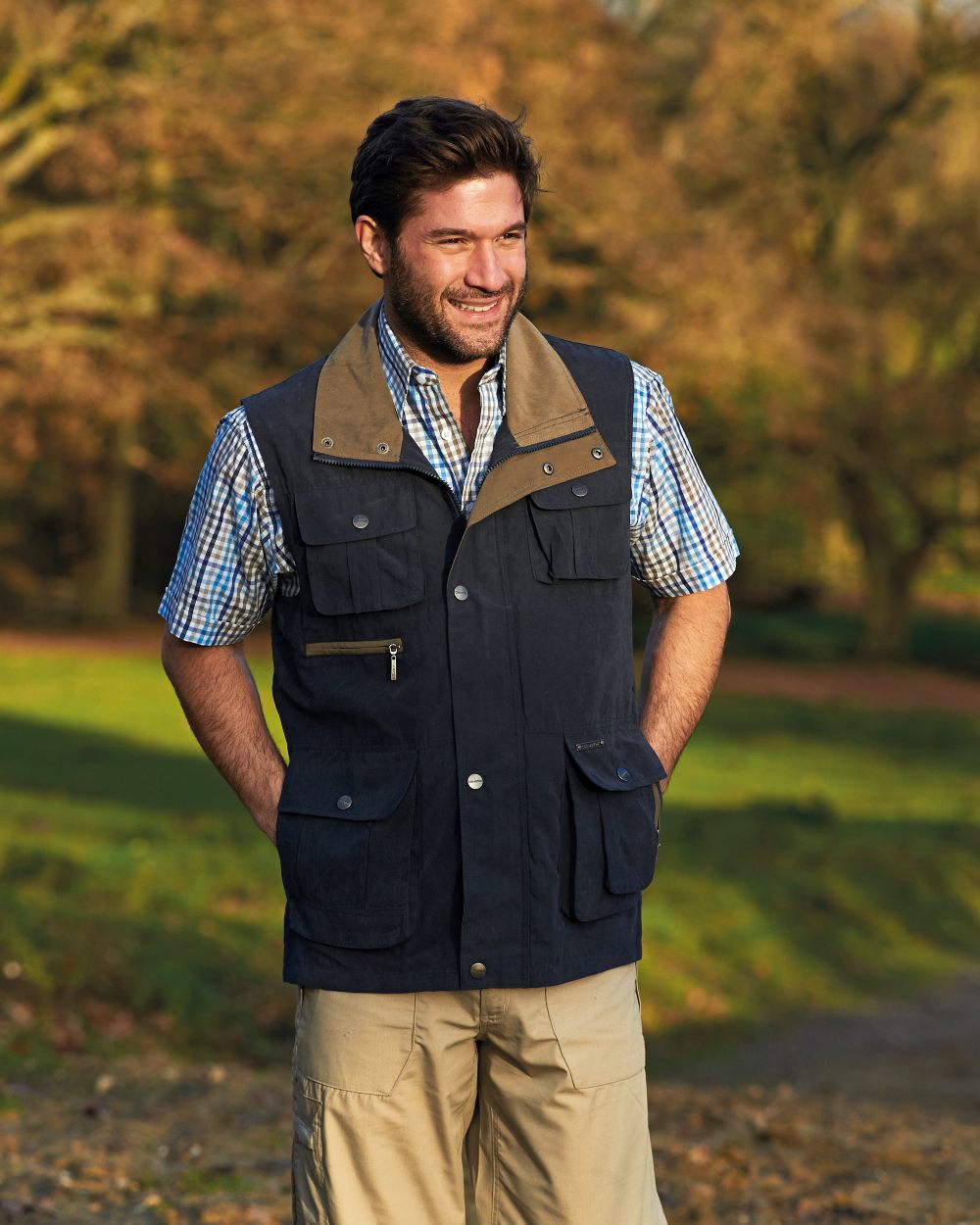 Navy coloured Champion Farnham Gilet on lawn background 