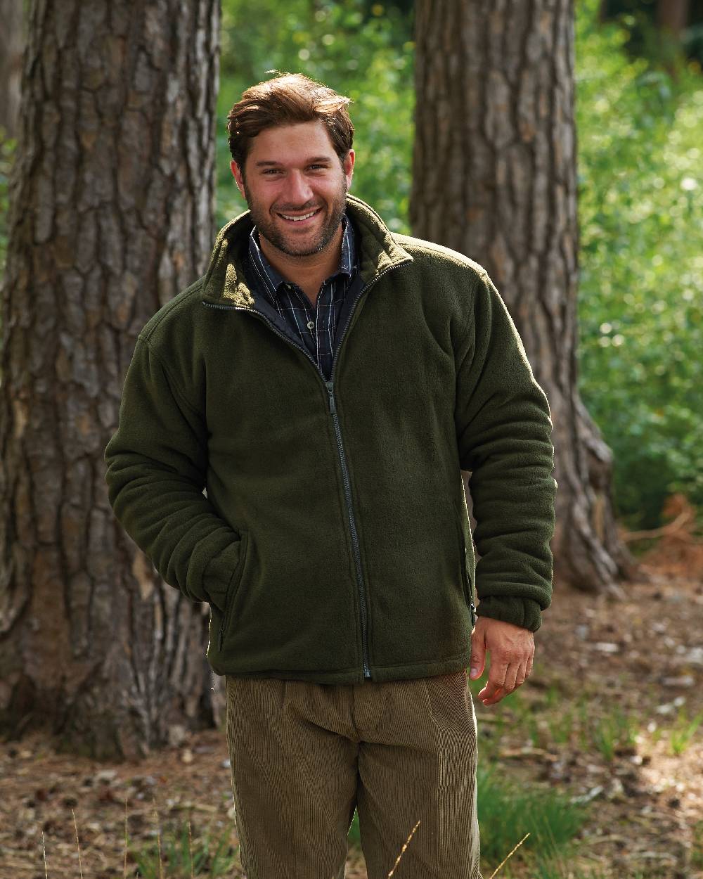 Olive coloured Champion Glen Fleece with Quilted Lining on forest background 