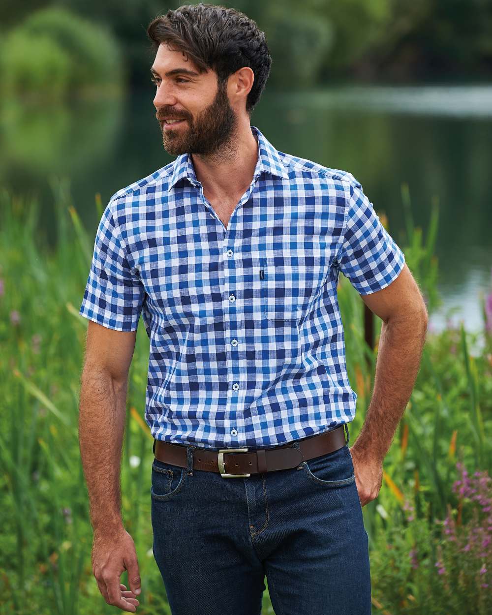 Blue coloured Champion Holkham Short Sleeved Shirt on river background 