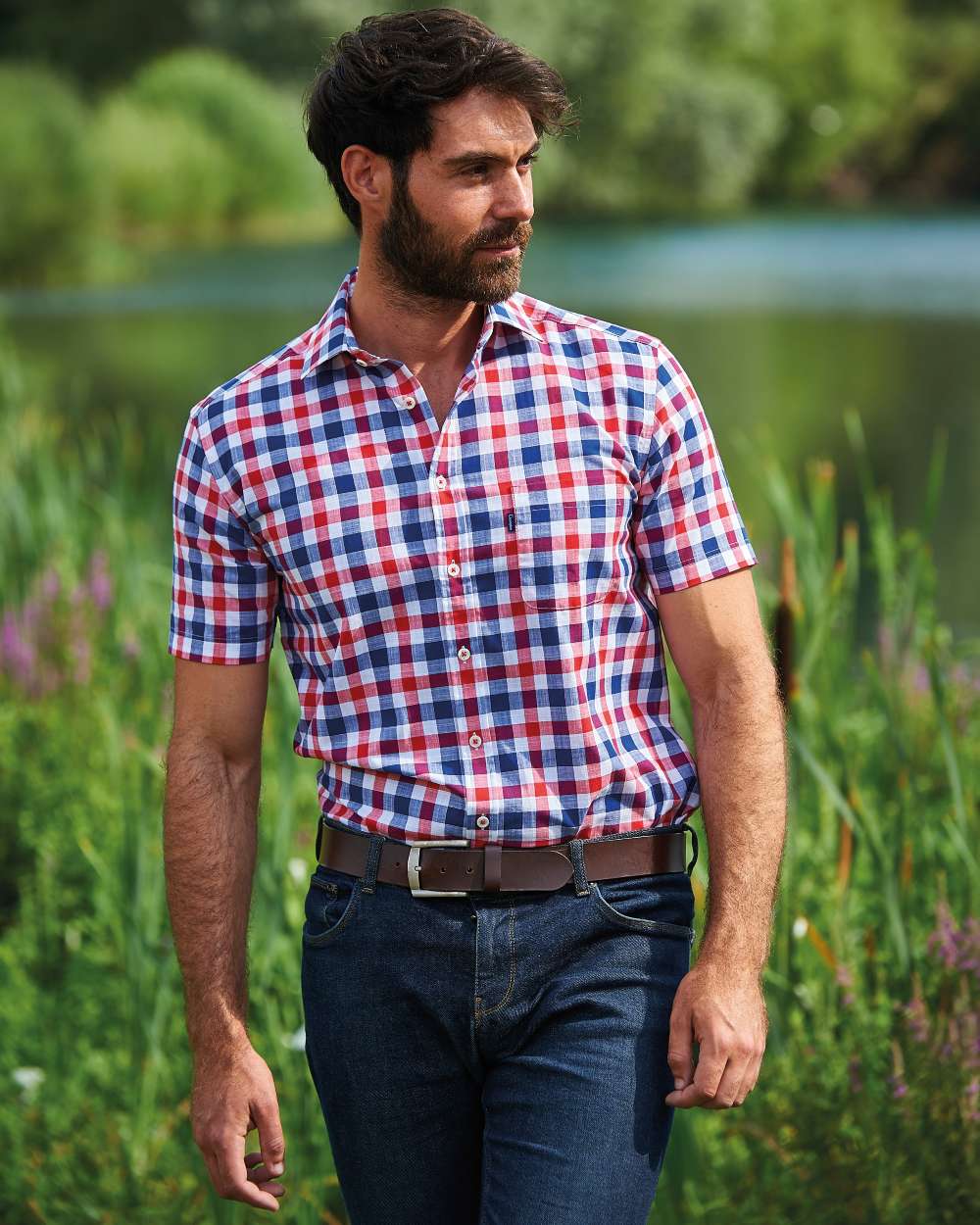 Red coloured Champion Holkham Short Sleeved Shirt on river background 