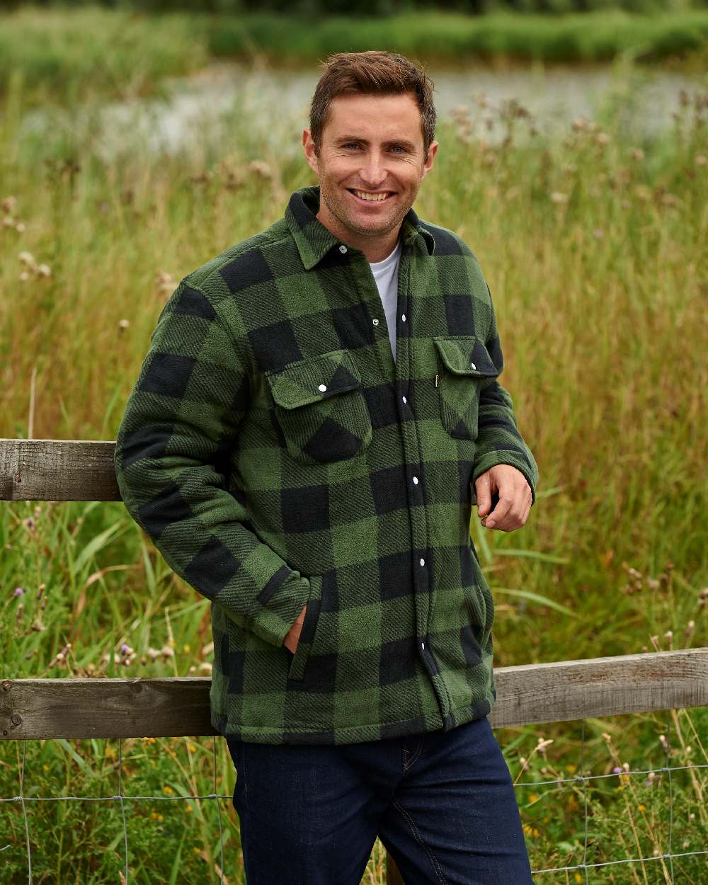 Green coloured Champion Kinross Padded Fleece Lumberjack Shirt on forest background 
