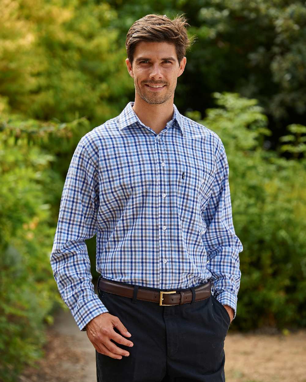 Navy coloured Champion Lyndhurst Check Shirt on forest background 