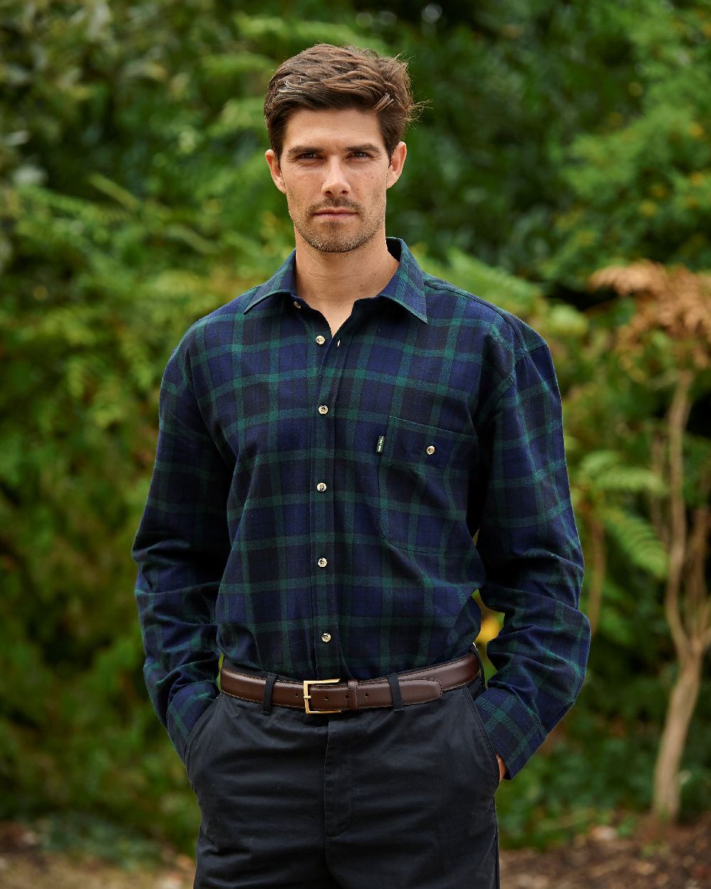 Green Navy coloured Champion Matlock Tartan Shirt on forest background 