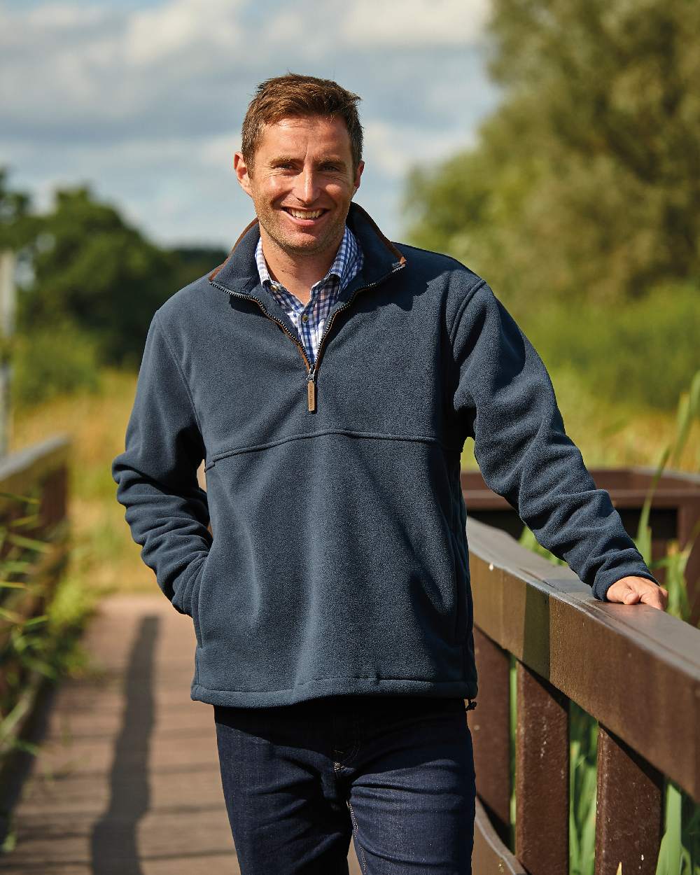 Navy coloured Champion Oban Half Zip Fleece on forest background 