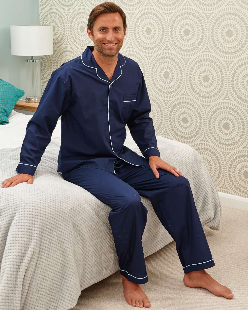 Navy coloured Champion Oxford Pyjamas on wall background 