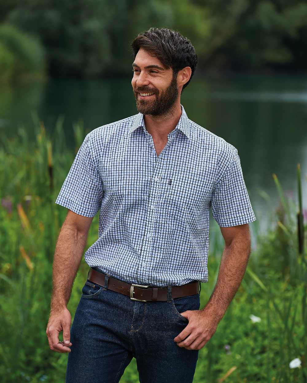 Blue coloured Champion Tattersall Short Sleeved Shirt on pond background 