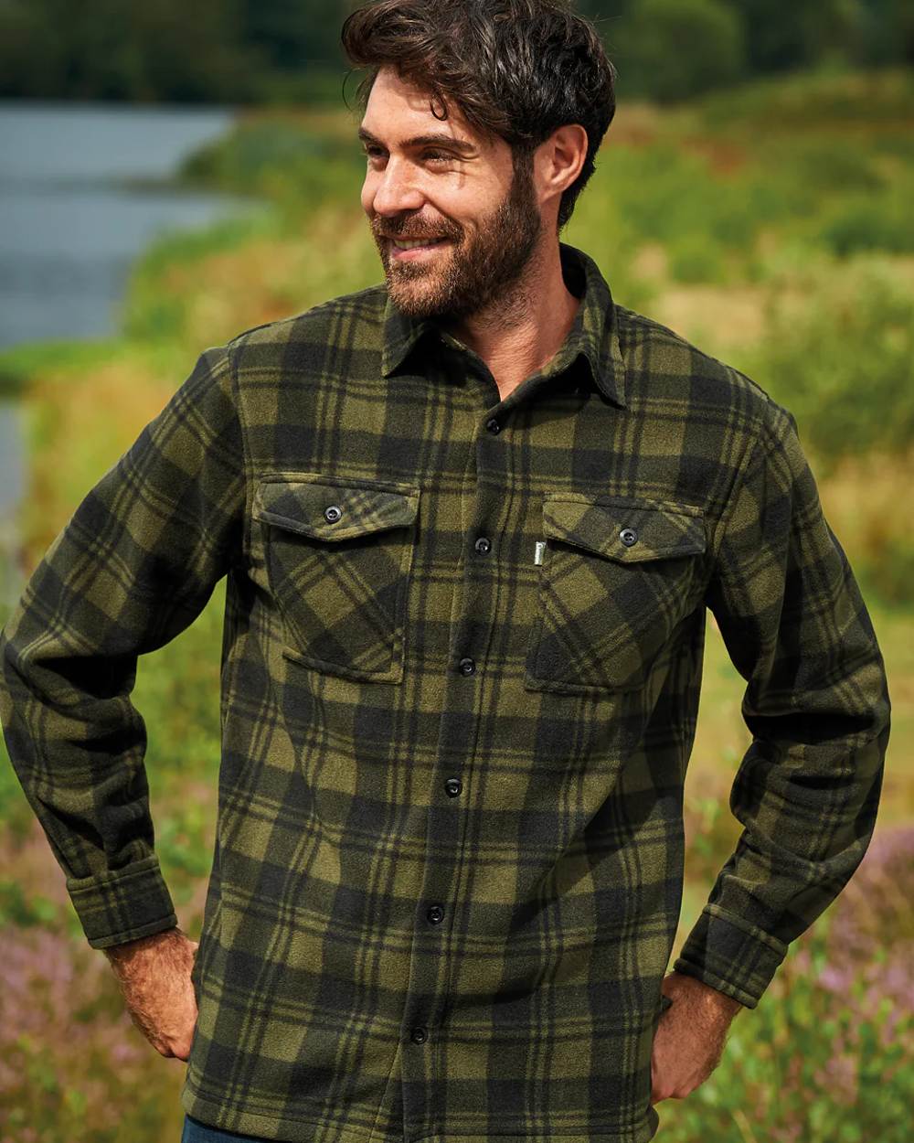 Green coloured Champion Esksale Fleece Lined Shirt on countryside background 
