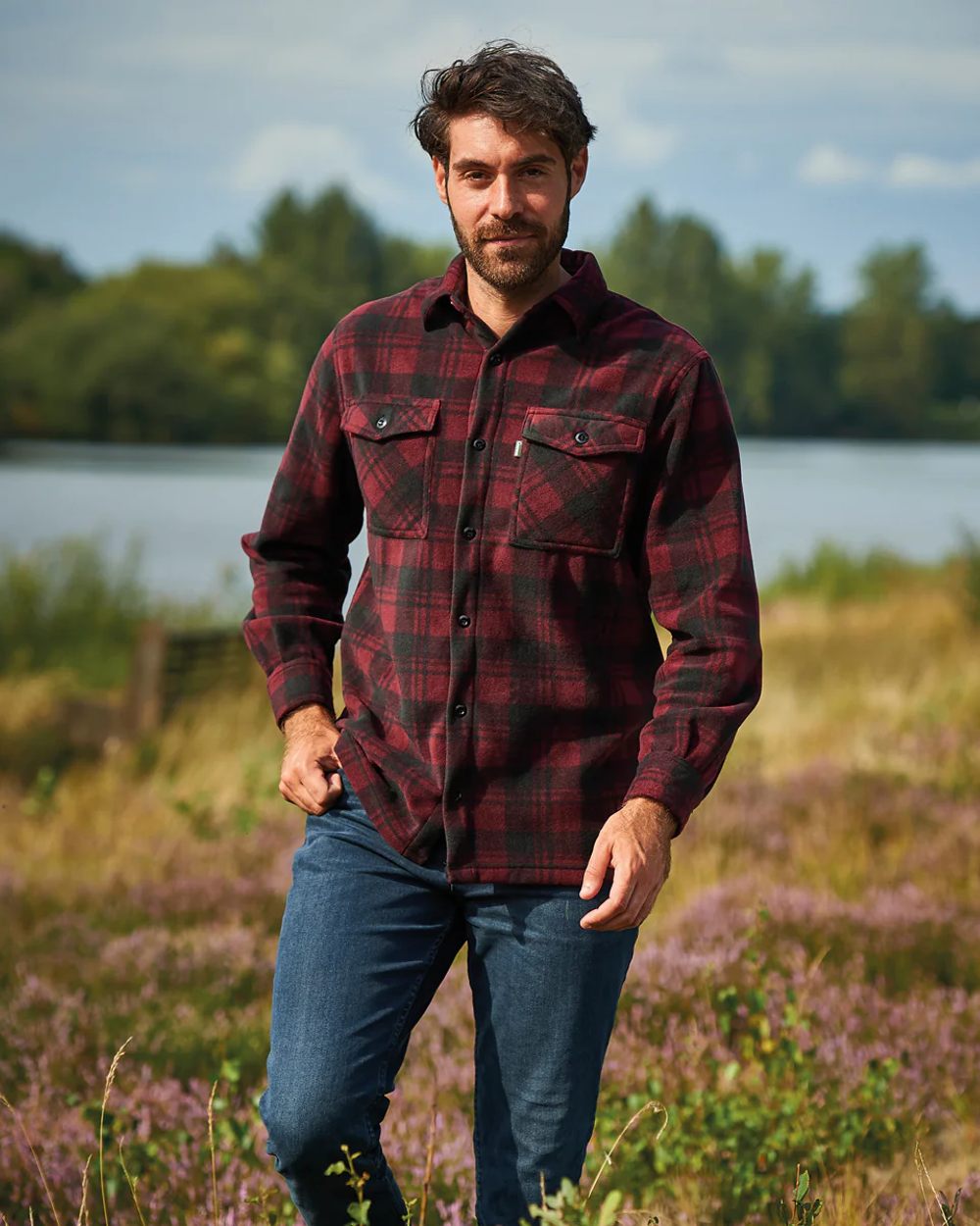 Red coloured Champion Esksale Fleece Lined Shirt on countryside background 