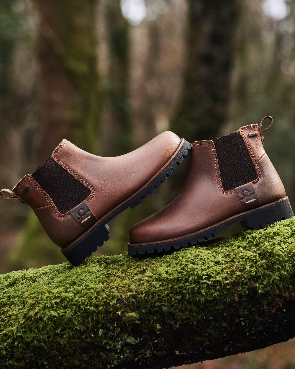 Chocolate Coloured Chatham Mens Southill II Waterproof Chelsea Boots on blurry background 