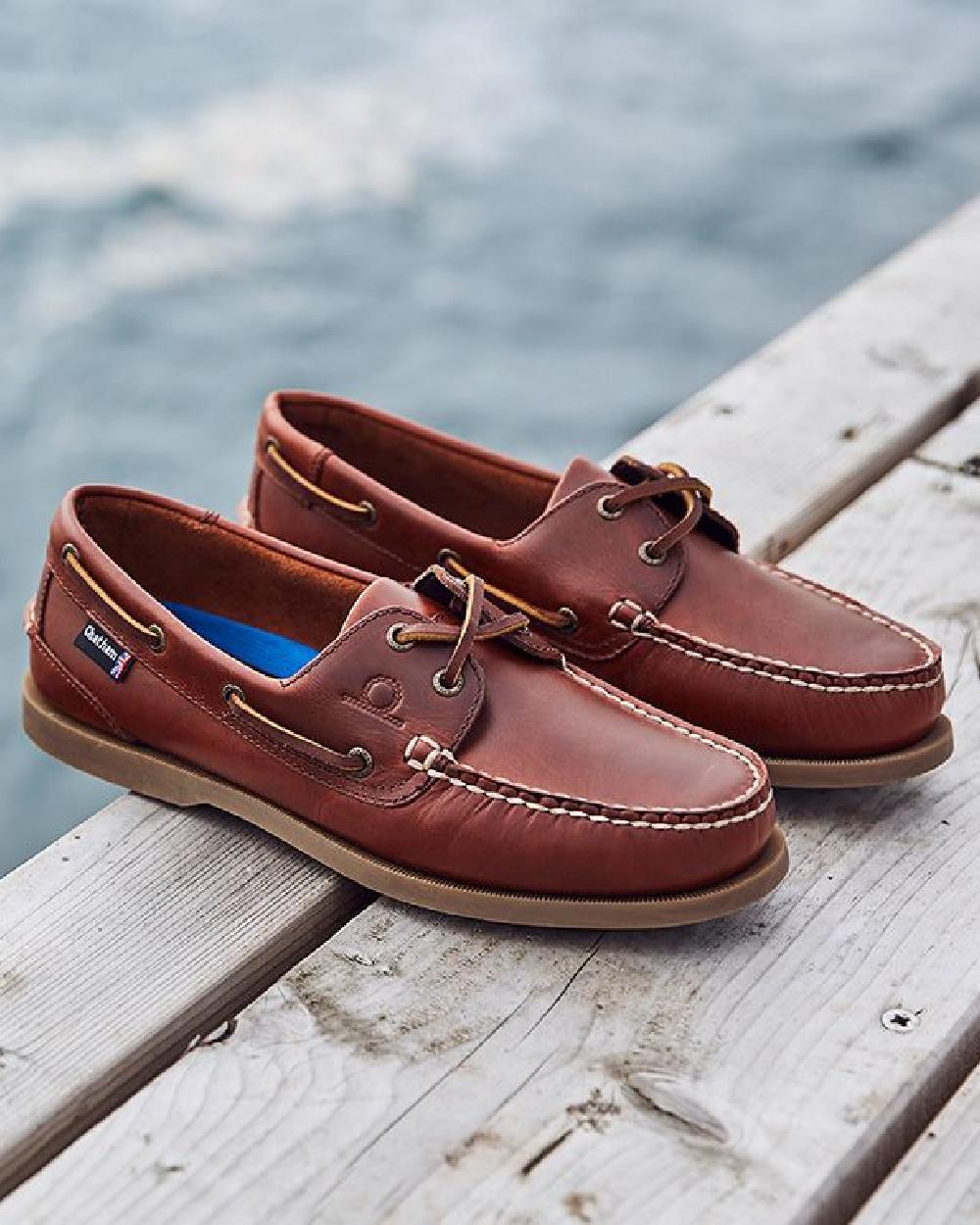 Chestnut Coloured Chatham Mens The Deck II G2 Premium Leather Boat Shoes on blurry background 