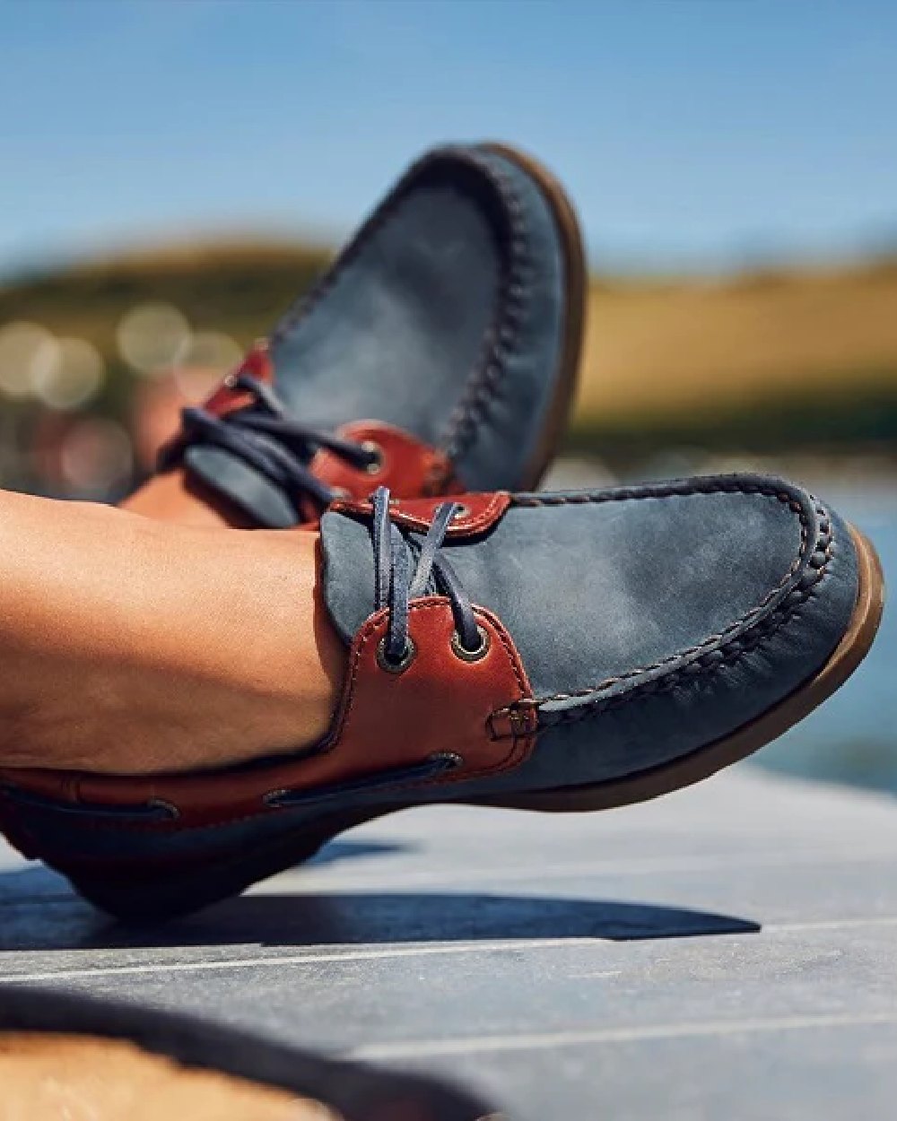 Navy Seahorse Coloured Chatham Womens Bermuda G2 Leather Boat Shoes on blurry background 