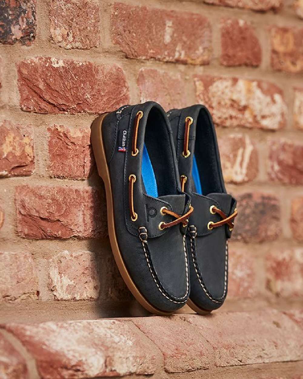 Blue Coloured Chatham Womens Deck II G2 Premium Leather Boat Shoes on wall background 