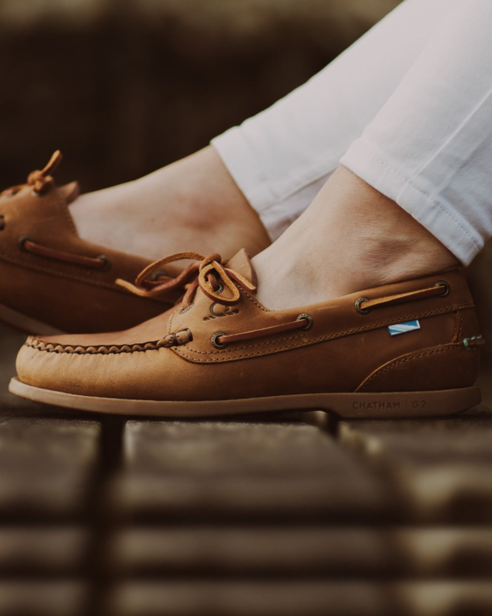 Walnut Coloured Chatham Womens Deck II G2 Premium Leather Boat Shoes on outdoor background 