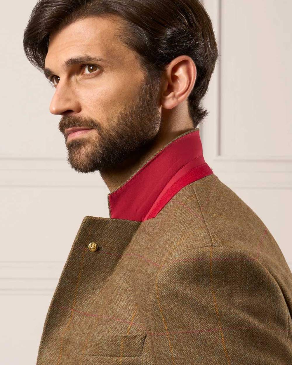Hawthorn coloured Alan Paine Combrook Mens Tweed Sports Blazer on wall background 