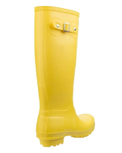 Yellow coloured Cotswold Sandringham Buckle Strap Wellingtons on white background 