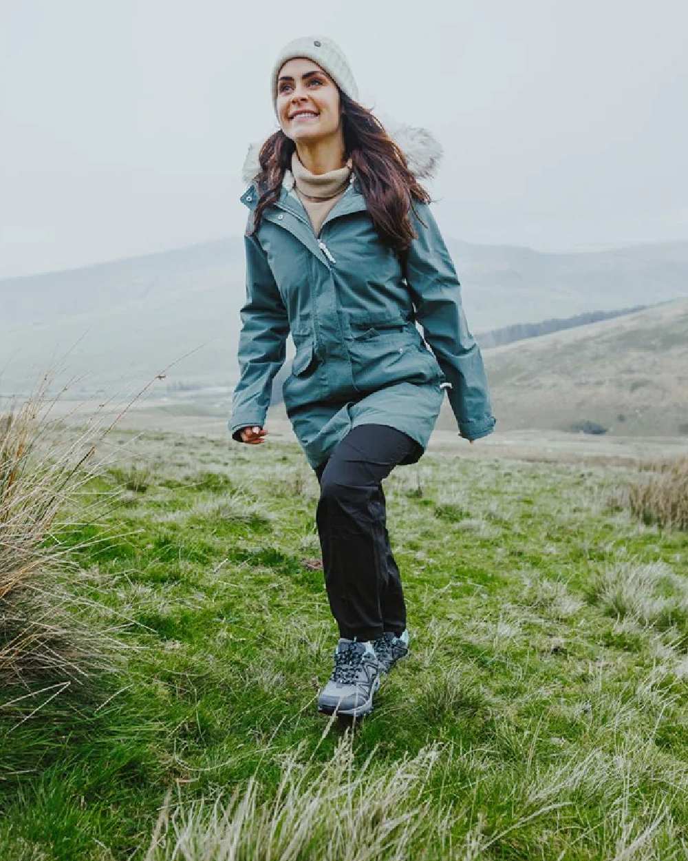 Grey/Black/Aqua coloured Cotswold Womens Abbeydale Low Hiking Shoes on grass  background 