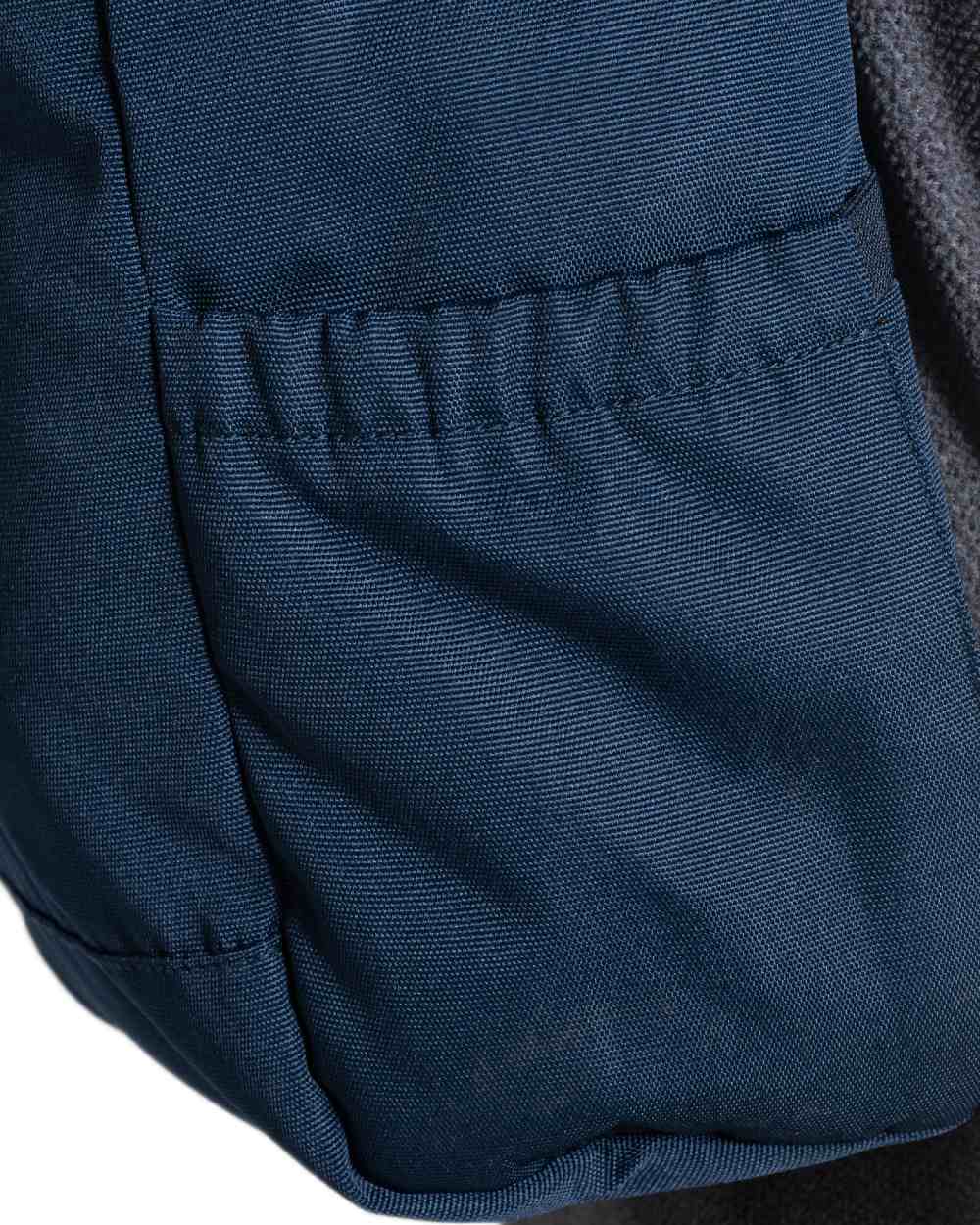 Blue Stone coloured Craghoppers 20L Kiwi Classic Rolltop Backpack II on white background 