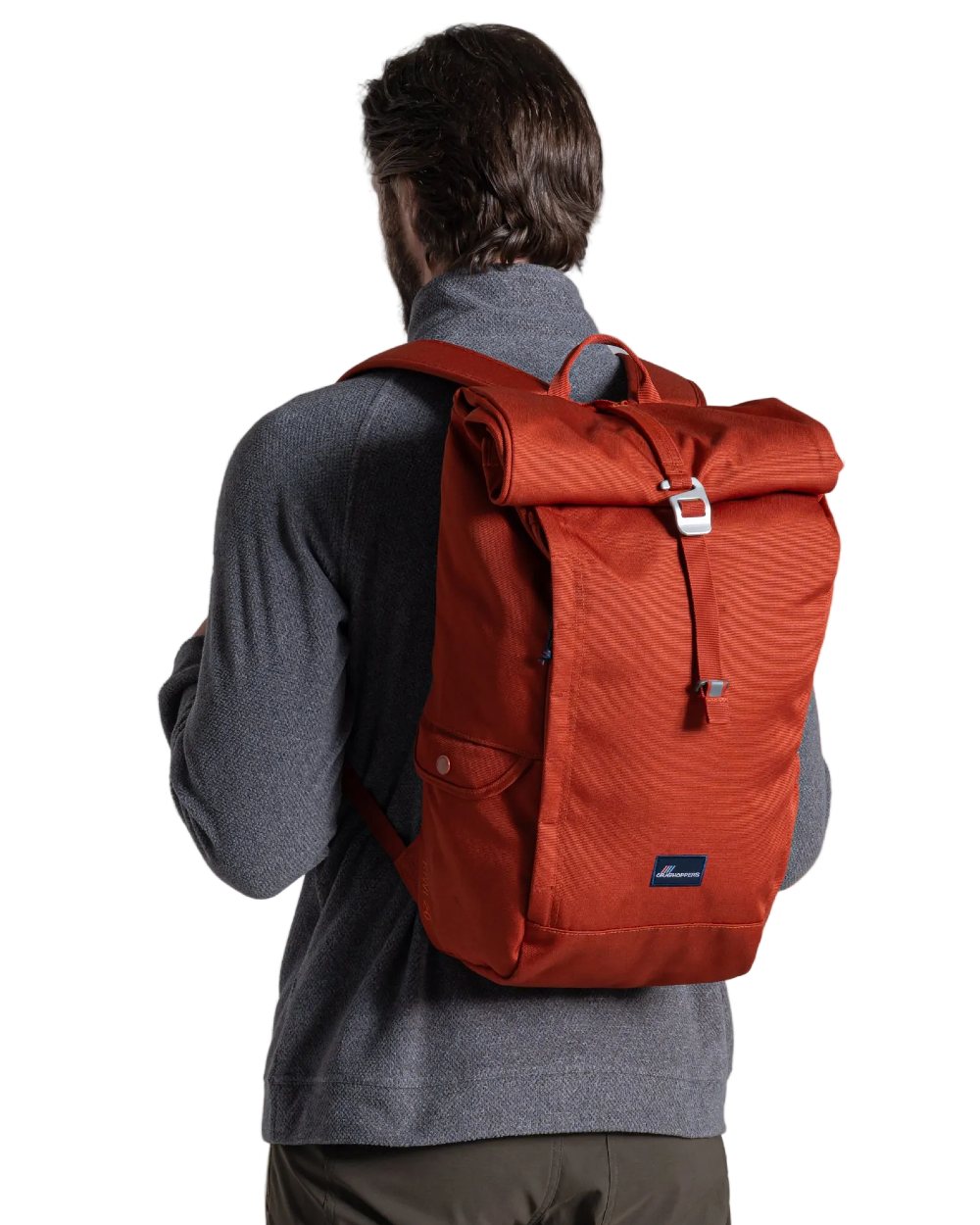 Red Beach coloured Craghoppers 20L Kiwi Classic Rolltop Backpack II on white background 