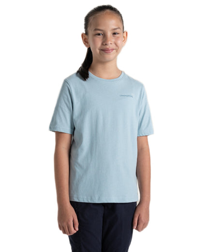Sky Blue coloured Craghoppers Childrens Ellis Short Sleeved T-Shirt on white background 