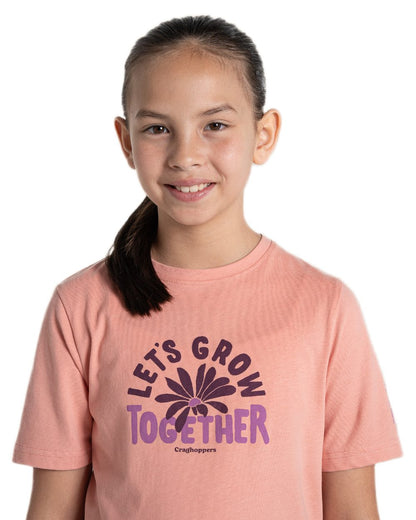 Sunset Haze coloured Craghoppers Childrens Ellis Short Sleeved T-Shirt on white background 