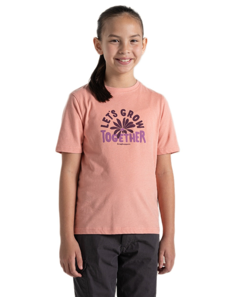 Sunset Haze coloured Craghoppers Childrens Ellis Short Sleeved T-Shirt on white background 