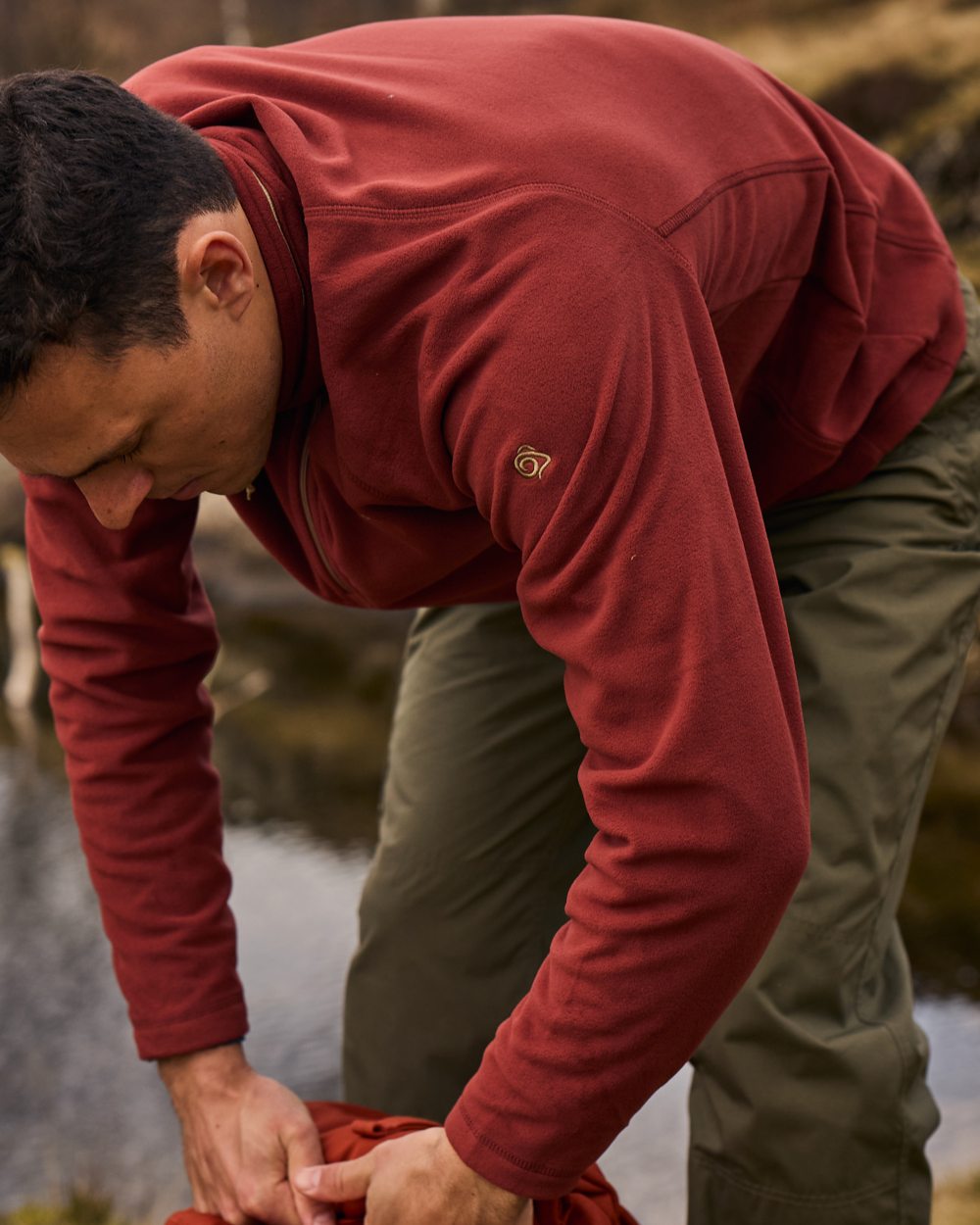 Red Jasper Coloured Craghoppers Corey VI Half Zip Fleece on mountain background 